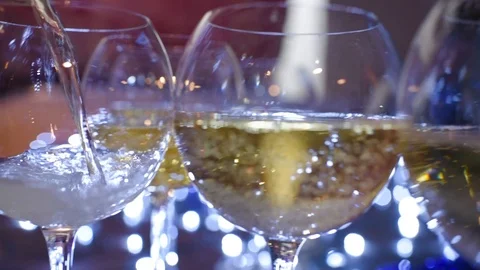Glasses with champagne on a blue background Stock Footage 99256312