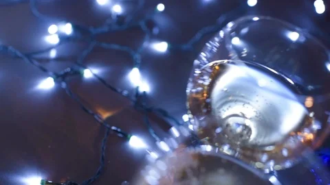 Glasses with champagne on a blue background Stock Footage 99256364