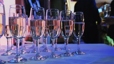 Glasses with champagne on the buffet table Stock Footage 87327005