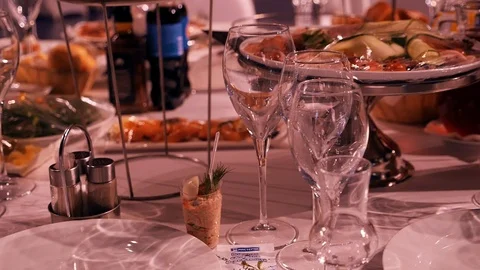 Glasses with champagne at a buffet table in a restaurant, side view Stock-Footage 111868233