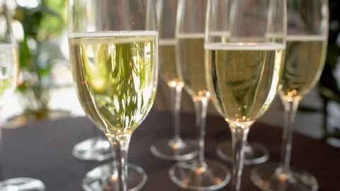 Glasses with champagne, slow camera span along Stock Footage 110811325