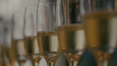 Glasses with champagne stand in a row. Stock Footage 233966192