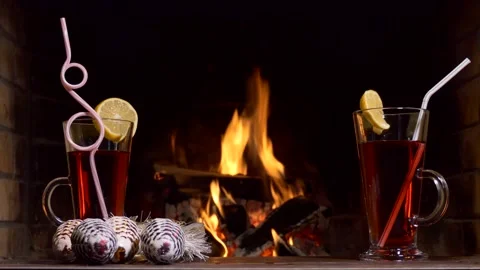 Glasses with cherry juice stand on a table decorated with Christmas decorations Stock-Footage 144866125