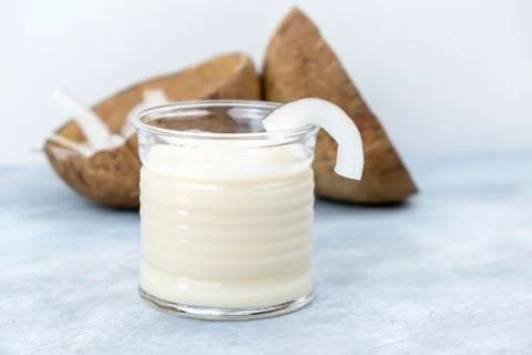 Glasses of coconut milk on the table. Selective focus. Stock Photos
