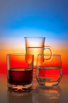 Glasses with drinks on beautiful gradient background 스톡 사진