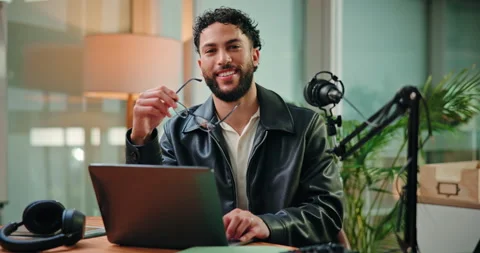 Glasses, face and man with mic in studio for podcast, broadcast and interview Stock Footage 312380653