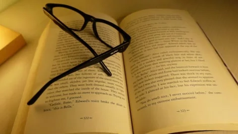 Glasses falling on the book - Sound off 스톡 동영상 143002782