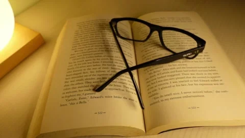 Glasses falling on the book - Sound off 스톡 동영상 143002786