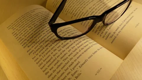 Glasses falling on the book - Sound off 스톡 동영상 143002854
