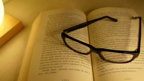 Glasses falling on the book - Sound off 스톡 동영상 143002863