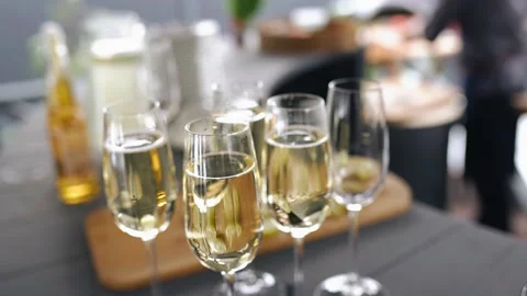 Glasses filled with wine are on the table in the bar at the event Stock Footage 156939358