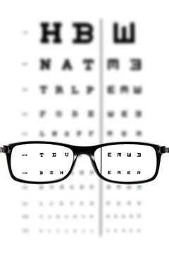 Glasses in front of an eye chart Foto stock