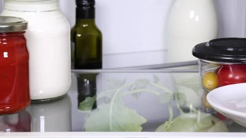 Glasses get misplaced in the fridge Video stock 135381382