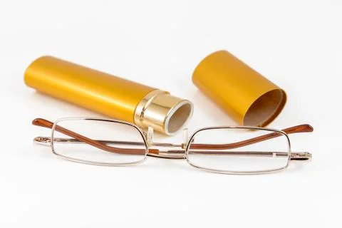 Glasses in gold case Stock Photos