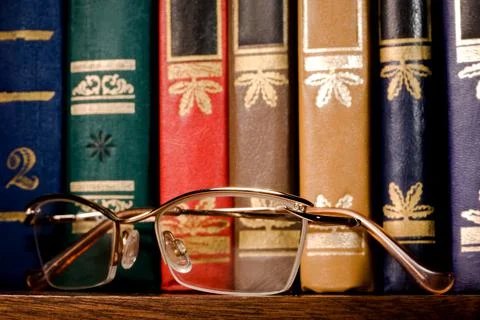Glasses in a gold frame Stock Photos