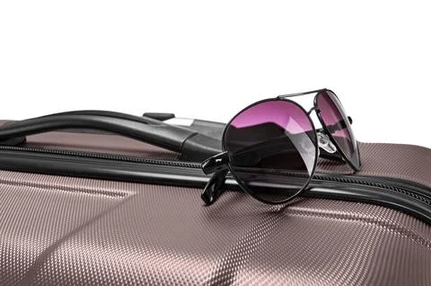 Glasses on gray suitcase Stock Photos