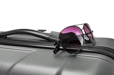 Glasses on gray suitcase Stock Photos