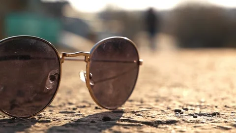 Glasses on the ground. 動画素材 122374256