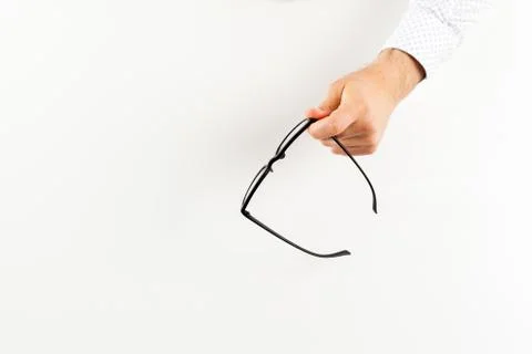 Glasses in hand. Stock Photos