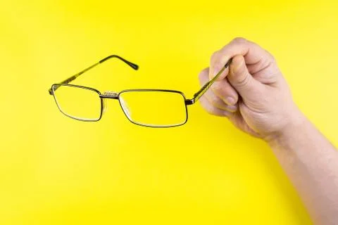 Glasses in hand Stock Photos