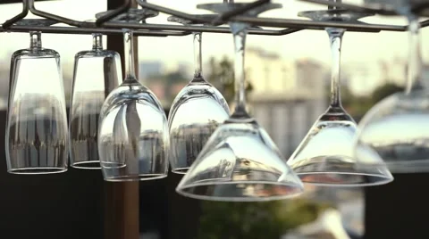 Glasses hanging, city background Video stock 60072471