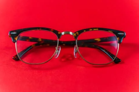 Glasses isolated on a red background Stock Photos