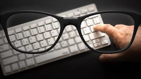 Glasses with keyboard sharp and blurred some black glasses with keyboard s... Foto stock
