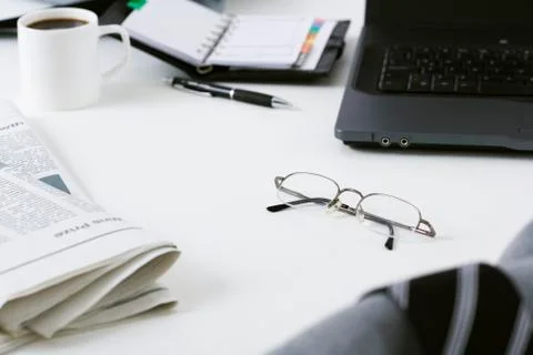 Glasses left on messy desk Stock Photos
