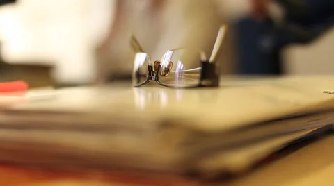 Glasses lying on the desk Stock Footage 41680466