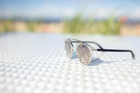 Glasses lying on table outside Stock Photos
