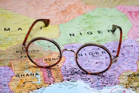 Glasses on a map - Abuja Stock Photos