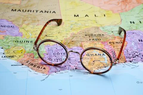 Glasses on a map - Ghana Stock-Fotos