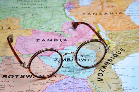 Glasses on a map - Harare Stock Photos