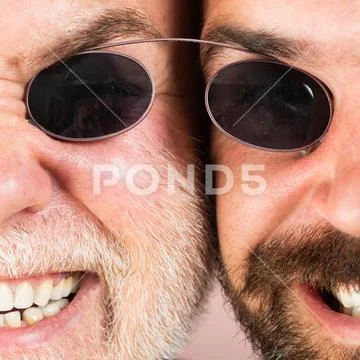 Glasses for men. Two Beardeds middle-aged mans wearing glasses looking at camera Stock Photos
