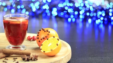 Glasses of mulled wine close-up with apple orange and cinnamon Video stock 145829377