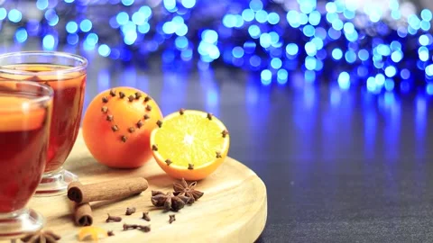 Glasses of mulled wine close-up with apple orange and cinnamon Video stock 145829391