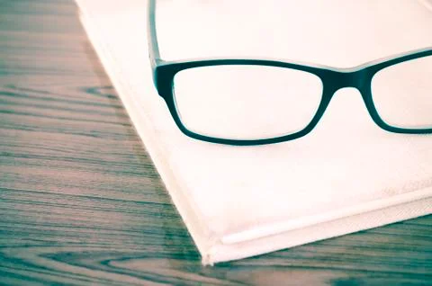 Glasses on notebook Stock Photos