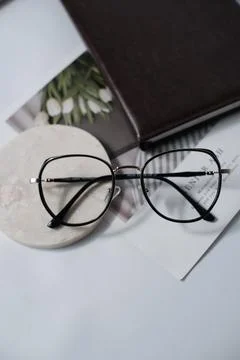 A glasses in office deck with document Stock Photos