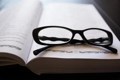 Glasses on the Open Book. Stock Photos