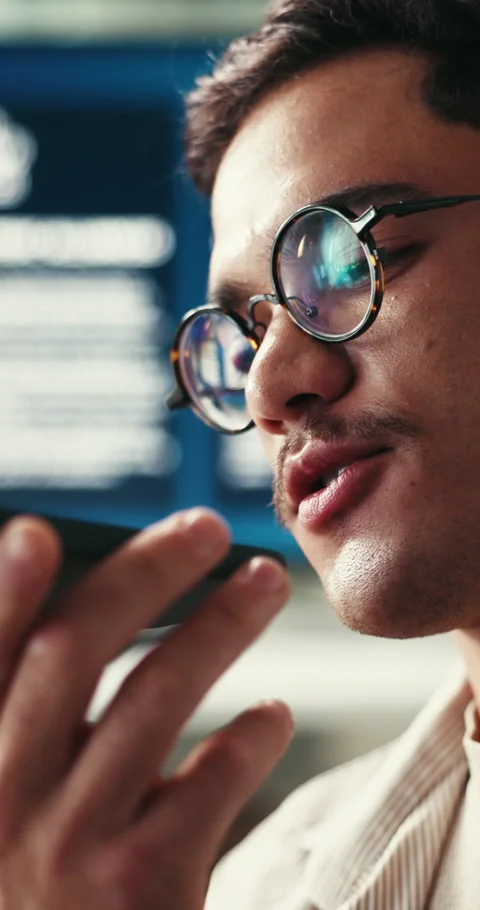 Glasses, phone call and web development with man in office for conversation Stock Footage 333458448