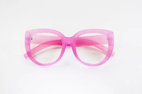 Glasses with pink transparent frames on a white background Stock Photos