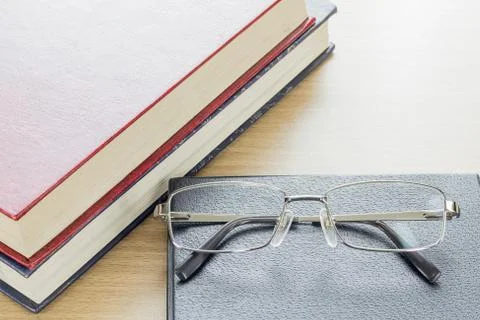 Glasses put on notebook Stock Photos