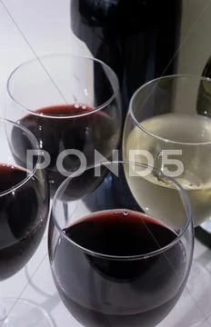 Glasses Of Red And White Wine