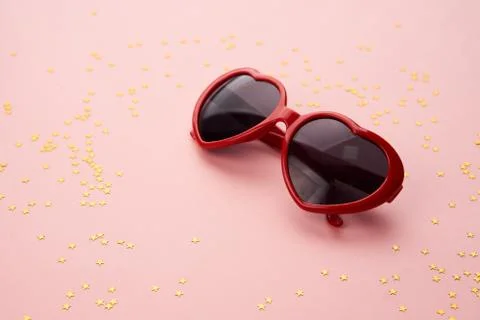 Glasses with red frames on a pink background Stock Photos