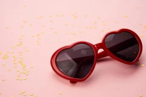 Glasses with red frames on a pink background Stock Photos