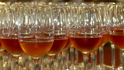 Glasses with red wine are on the table. alcoholic drinks for guests Stock Footage 90082731
