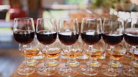 Glasses of red wine are on the table Stock Footage 119600077