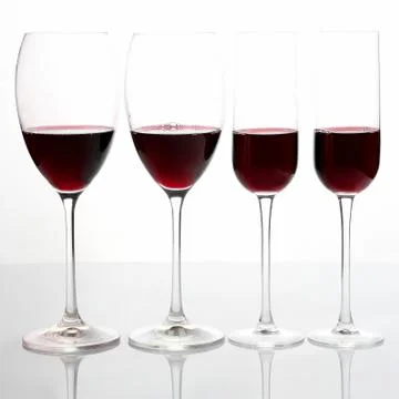 Glasses with red wine on a light background Stock Photos