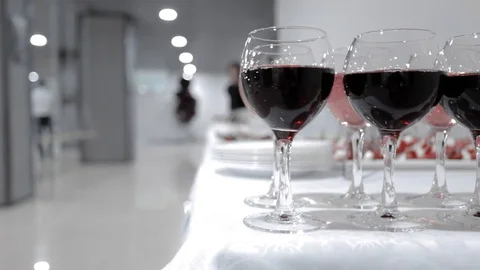 Glasses of red wine at a party Stock Footage 83206367