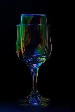 Glasses with reflection of colored rays of light Stock Photos